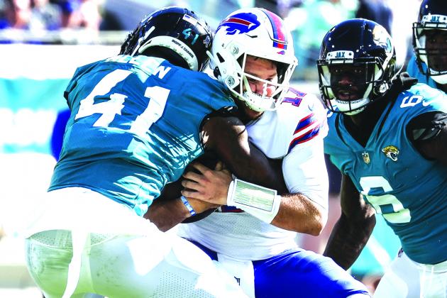 Buffallo Bills quarterback Josh Allen (17) is sacked by Jacksonville Jaguars linebacker Josh Allen (41) during Sunday’s 9-6 Jaguars win at T.I.A.A. Bank Field. (JOHN STUDWELL / Special to the Daily News)