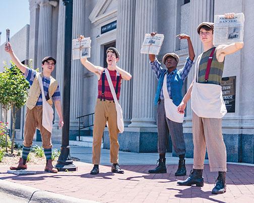 Cast members of a previous production of “Newsies” promote the show while dressed in character in downtown Palatka.