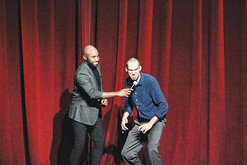 Jason Bush, left, watches Shane Camp demonstrate a facial expression he used when he played Thenardier during a Palatka High School production of Les Miserables.