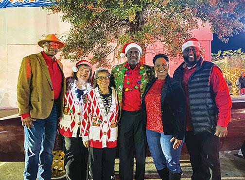 Past and present Palatka officials smile before they ride in the city’s Christmas parade. 