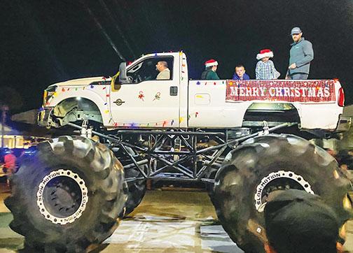 A decked-out monster truck wows the crowd Friday during the Palatka Christmas Parade.