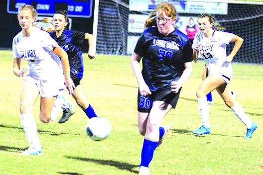 Interlachen’s Allison Greenan chases down the ball as Calvary Christian’s Ella Rensberry (left) and Azlin Thrasher (13) trail behind during Thursday’s soccer match. (MARK BLUMENTHAL / Palatka Daily News)