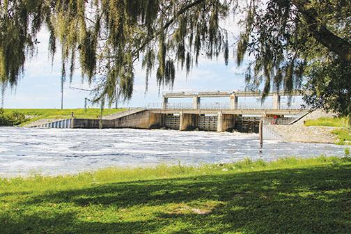 Water flows through the Rodman Dam, a structure some want demolished and others want to stay put.