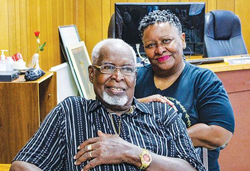 Welaka Town Council member Willie Washington, who died in March, sits in front of his daughter, Kathy Washington, who was eventually appointed to succeed him