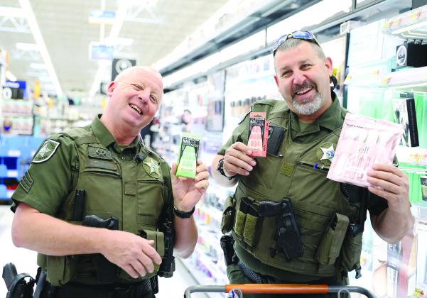 Putnam County Sheriff's Office deputies suggested stylish press-on nails and make-up brushes for Christmas gifts Monday at Walmart while participating in the agency's Shop With a Deputy event. Allison Waters-Merritt/Putnam County Sheriff's Office
