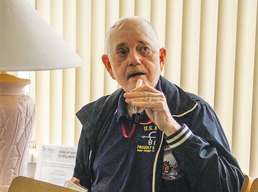 Satsuma resident and Vietnam War veteran Spencer Wainright III demonstrates his Stop One Suicide whistle Monday at the Putnam Habitat for Humanity office.
