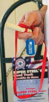 The Stop One Suicide whistle is equipped with a ribbon for veterans to wear it around their neck and a dog tag featuring the Veterans Crisis Lifeline. 