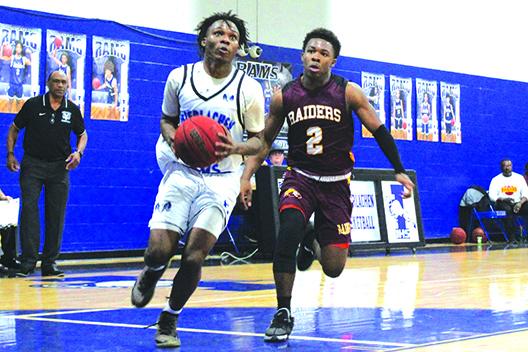 nterlachen’s Deon Fells goes to the basket for a layup as Crescent City’s Naykeem Scott pursues him during the fourth quarter of Friday night’s game. (MARK BLUMENTHAL / Palatka Daily News)