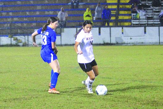Crescent City girls soccer player Miriam Ocampo looks to make moves with the ball against Palatka’s Addison Nettles during a scoreless tie in December. (MARK BLUMENTHAL / Palatka Daily News)