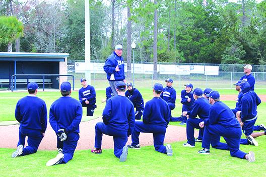 St. Johns River State College baseball coach Ross Jones goes over signals with his players during practice Thursday. (MARK BLUMENTHAL / Palatka Daily News)