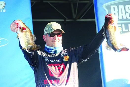 Cliff Prince shows off some of his catches at last February’s Bassmaster Elite at the St. Johns event. (Daily News file photo)