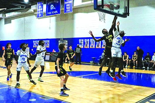 St. Joseph Academy’s Larry Mitchell (25) and Interlachen’s Reggie Allen Jr. go up for a rebound during Tuesday night’s game won by the Flashes. (RITA FULLERTON / Special to the Daily News)