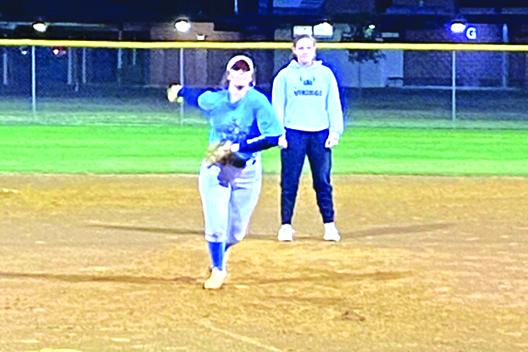 Lexi Phillips throws a pitch during a St. Johns River State College softball intra-squad game, while infielder Katie Thomas watches behind her. (COREY DAVIS / Palatka Daily News)