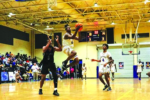 Palatka’s Jimmie Williams goes up for a first-quarterl layup as Orange Park Ridgeview’s Ezarius Wilson (left) and Palatka’s Chavaris Dumas look on. (RITA FULLERTON / Special to the Daily News)
