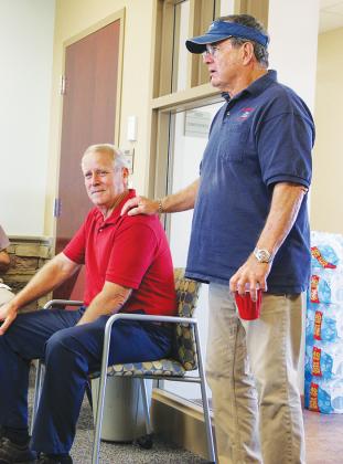 Outgoing Palatka Municipal Airport manager John Youell listens as former Airport Advisory Board member Jeff Hathorn tells stories Wednesday of Youell’s years in leadership.