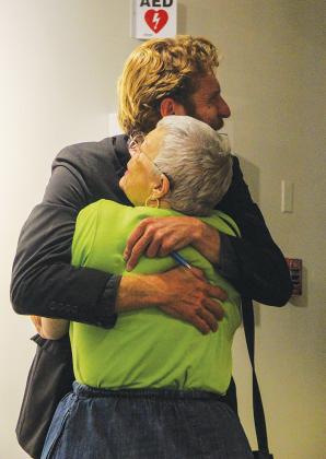 Dietrich hugs a fan after the show.