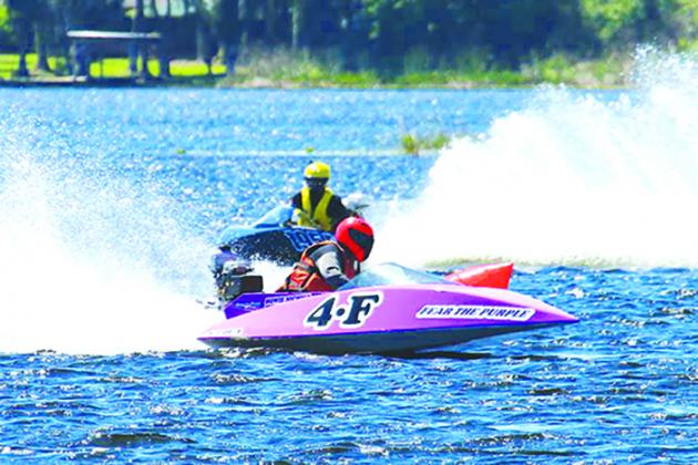 Howie Nichols of Cocoa rides the waters of Lake Stella in his Fear The Purple 4-F boat during Sunday’s Romp In The Swamp competition. (Contributed / JESSE LYONS)