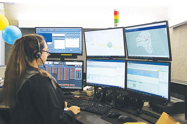 Cassie Blehm-Cummings monitors Putnam County’s emergencies on her six computer screens Wednesday.