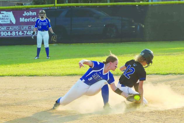 Peniel Baptist Academy’s Alyssa Wallace (12) slides safely into second base with a stolen base ahead of the tag of St. Francis shortstop Kaylie Lamberson in the first inning. (RITA FULLERTON / Special to the Daily News)