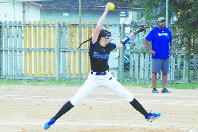 Alexis Wallace delivers a pitch to a St. Francis batter during Thursday’s District 4-2A championship game at Rotary Park. (RITA FULLERTON / Special to the Daily News)
