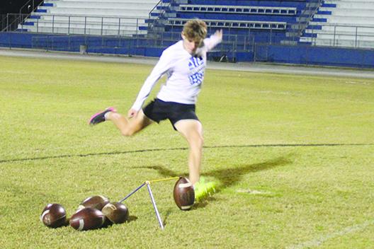 Austin Lloyd delivers a kick during a personal workout last fall at his alma mater, Interlachen High School. (MARK BLUMENTHAL / Palatka Daily News)