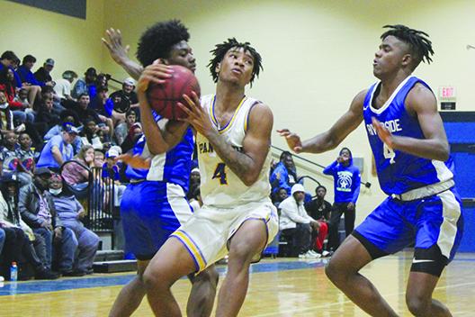 Palatka’s Chavaris Dumas (middle) was a member of last year’s All-County boys basketball team as the point guard for Interlachen High. (MARK BLUMENTHAL / Palatka Daily News)