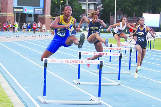 Palatka's Al'Leah Ford leaps over the first hurdle while running the 300-meter intermediate hurdles at the FHSAA 2A championship at the University of Florida on Thursday. (MARK BLUMENTHAL / Palatka Daily News)
