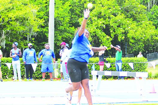 Palatka’s Torryence Poole unleashes one of her shot put tosses Thursday en route to winning the FHSAA 2A championship at the University of Gainesville. (MARK BLUMENTHAL / Palatka Daily News)