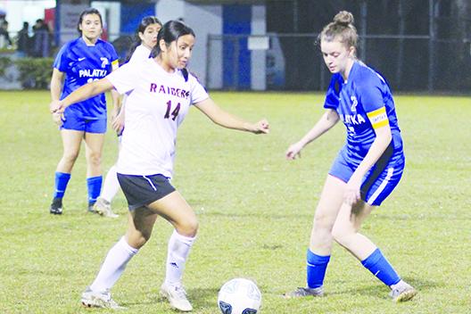 Crescent City’s Miriam Ocampo (left) and Palatka’s Mattie Smith vie for a loose ball during the Dec. 15 game at Bennett-Cooper Field at Veterans Memorial Stadium. Both are on the All-County team. (MARK BLUMENTHAL / Palatka Daily News)