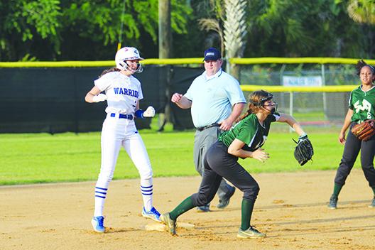 Alexis Wallace (left) pitched and helped hit her Peniel Baptist Academy softball team to a third straight district championship this spring. (MARK BLUMENTHAL / Palatka Daily News)