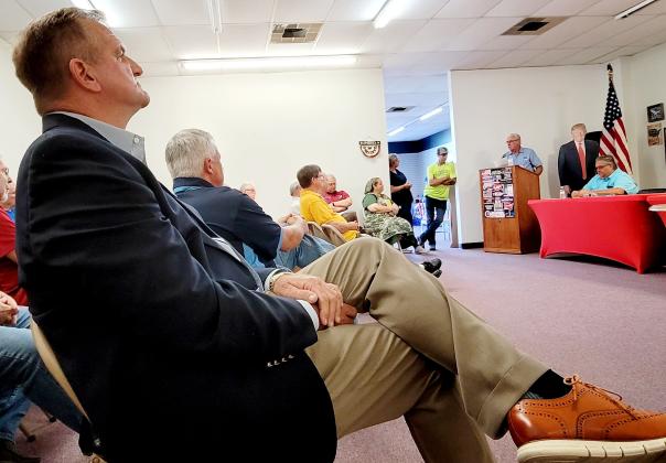 Incumbent Larry Harvey, who is running against Tom Williams in the Republican primary for the Board of County Commissioners District 4 race, listens as Williams, the Republican Executive Committee chair, speaks about his views on endorsing candidates at a REC meeting earlier this month. (Palatka Daily News file)