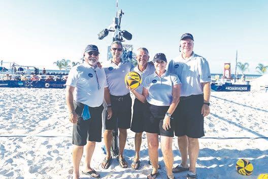 Rick Breed (center) poses with other officials during a break at the NCAA Beach Volleyball championships at Gulf Shores, Alabama, in May. (Submitted Photo)