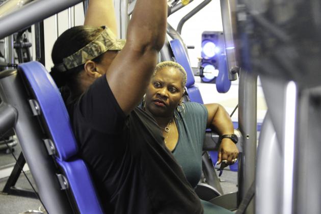 Photo by Sarah Cavacini/Palatka Daily News. Personal trainer Tracei Salome Hutcherson works with her client, Patricia Spell, as she completes one exercise Friday afternoon at Hutcherson's Palatka facility. 