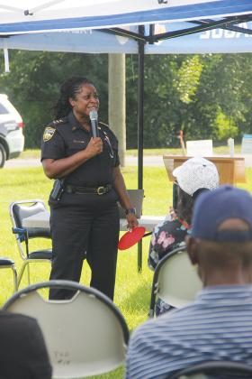 Jacksonville Sheriff’s Office Assistant Chief Deloris O’Neal tells the people gathered at Victory in the Village stories about her childhood in Palatka.