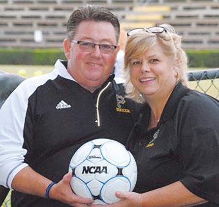 Piscitello and his wife, Kathy, prepare for a Palatka High soccer match. Capt. Piscitello has coached boys and girls soccer since he began working with the student-athletes in 2006.