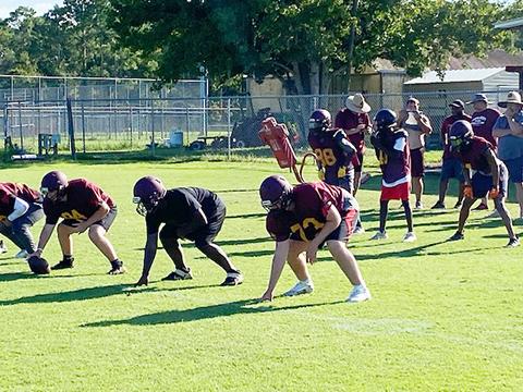 Crescent City sophomore quarterback Eric Jenkins calls the play during Thursday’s practice, while coaches look on in the background. (Corey Davis/ Palatka Daily News)