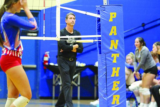 Palatka volleyball coach Robert Bush looks at the scoreboard after his team lost the third set to Keystone Heights at home Wednesday night. (MARK BLUMENTHAL / Palatka Daily News)