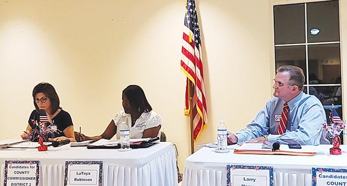 From left, Leota Wilkinson, La’Toya Robinson and Larry Harvey, candidates for the Putnam County Board of Commissioners, participate in a political forum Monday night.