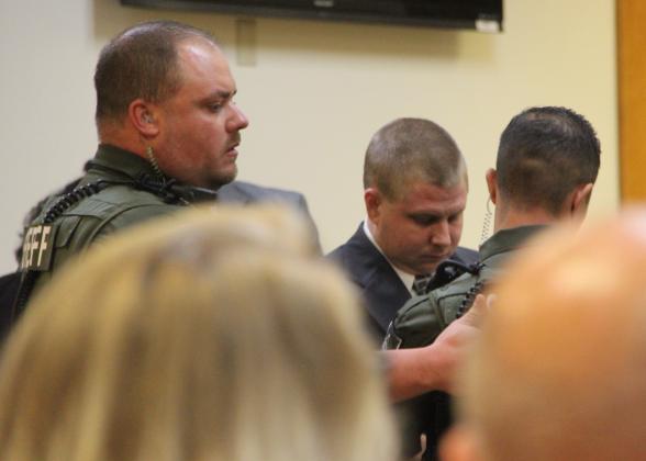 Deputies escort Mark Wilson Jr. from the Putnam County Courthouse Annex following a jury's recommendation of death.
