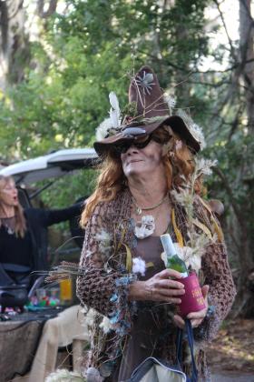Patsy Anderson smiles in her witches outfit before heading out to Lake Santa Fe in Melrose during the witches paddle Friday. 