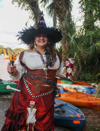 Mary Ellen Haase, who grew up on Lake Santa Fe in Melrose, smiles as she gets ready to paddle on the lake during this year's witches paddle in Melrose. 