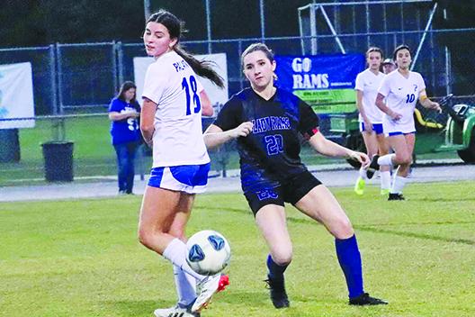 Interlachen’s Erin Jacobsen (20) goes after a ball behind Palatka’s Lanie Hutchinson during the first half of Friday’s match at Feltner Field at Thompson-Baker Stadium. (RITA FULLERTON / Special to the Daily News)