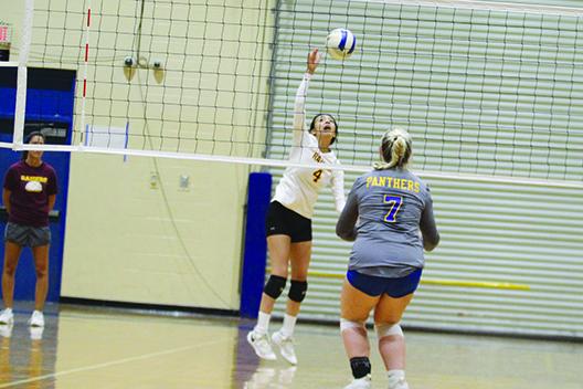 Crescent City’s Aleni Carbajal (left), the Daily News Player of the Year, attempts to hit the ball back over the net during the Putnam County Tournament match with Palatka on Sept. 3. (MARK BLUMENTHAL / Palatka Daily News) 