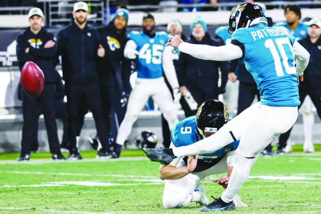 Jacksonville’s Riley Patterson delivers the game-winning field goal to defeat the Los Angeles Chargers, 31-30, on Saturday night. Holding the kick is Logan. (JOHN STUDWELL / Special to the Daily News)
