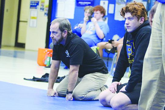 Palatka Junior-Senior High School wrestling coach Josh White (left) watched his team go 1-2 at the District 4-1A duel tournament. (MARK BLUMENTHAL / Palatka Daily News)
