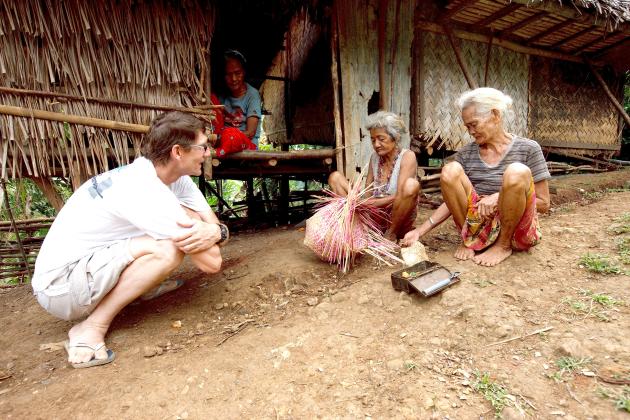 Jody Crain, left, visits with two grandmother – both witch doctors who he said were miraculously saved and eventually influenced their whole clans to become Christ followers. -- Photo submitted by Jody Crain