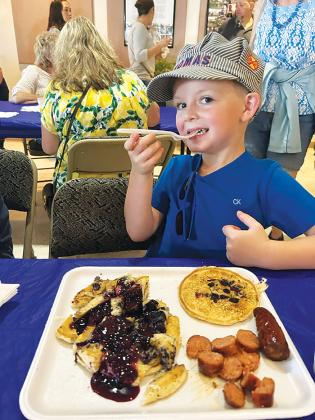 Photo submitted by Crystal Anderson-Alexander Logan Alexander enjoys the blueberry pancake breakfast before taking in the rest of the festival.