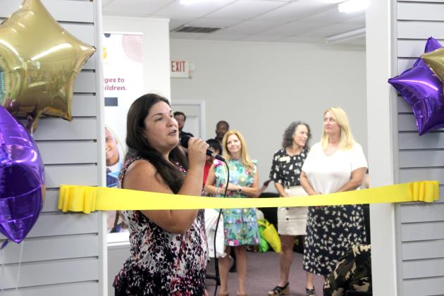 TRISHA MURPHY / Palatka Daily News. Jacqueline Cox, director of the Putnam County Wellness Center, welcomes guests to the center’s unveiling Thursday at 320 S. State Road 19 in Palatka.