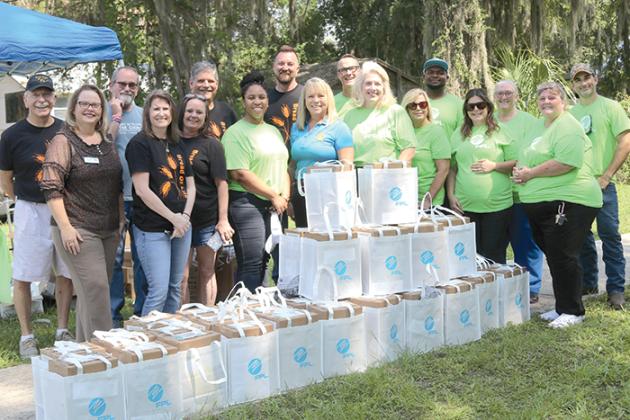 Representatives from Florida Power & Light, Suwannee River Economic Council in Palatka, United Way of St. Johns County and First Presbyterian Church of Palatka volunteer at a hurricane meal kit distribution earlier this week.