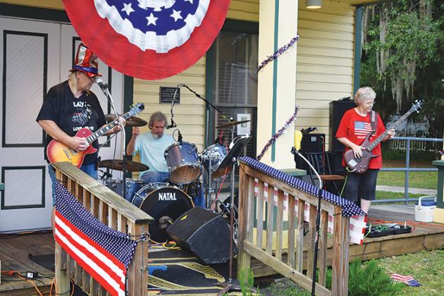 The band Lazy J and Co. performs Tuesday evening in downtown Interlachen during the town’s celebration of Independence Day.
